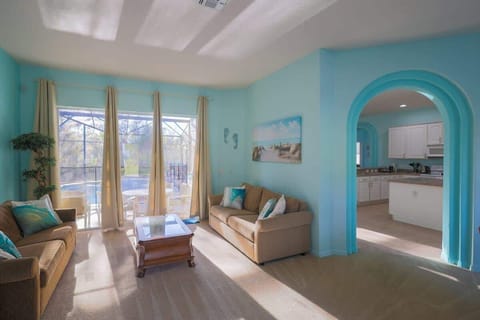Living room area with great view of the pool.