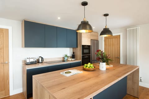 Beachside, Ground Floor: With a double electric oven, induction hob, microwave, fridge/freezer and dishwasher