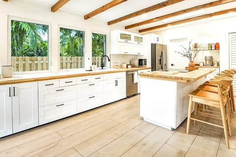Spacious, stocked kitchen with complete set of cookware.