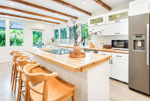 Spacious, stocked kitchen with complete set of cookware.