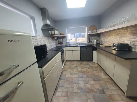 The kitchen comes equipped with fridge/freezer, electric oven and hob, dishwasher and microwave