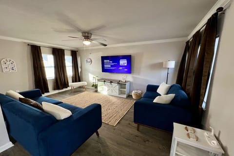 A stylish living room to make you feel at home with a 60' Roku Smart TV.