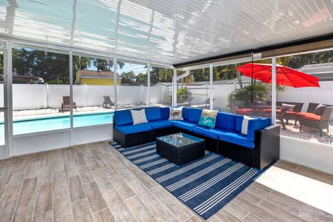 Relax in the Shaded Screened-in Patio with Access to In-Ground Pool
