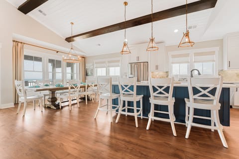 Dining table seats 10. Bar seating for 9. Outdoor dining table seats 8.