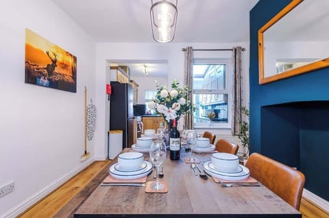 The spacious dining room has space to seat up to 6 people comfortably and is the perfect space to sit down with family and friends for an evening meal or catch up on emails if you are working remotely.