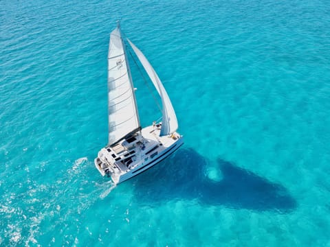 Location Under Sail near Staniel Cay with incredible shadow on ocean floor.
