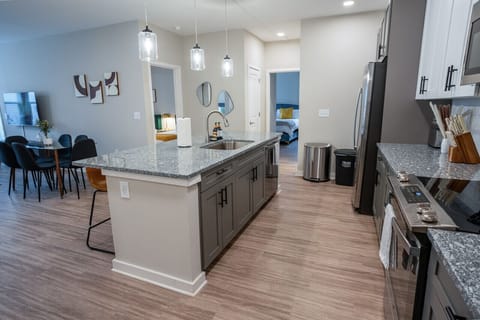 This kitchen counter extends into a welcoming dining table that comfortably seats 6.