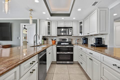 Unique galley kitchen with pass through on the side opposite the living room