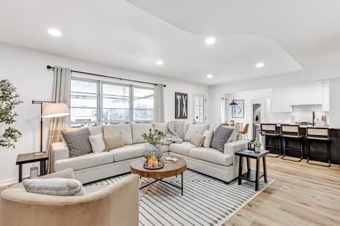 A bright and spacious living area with seamless integration into the modern kitchen, designed for stylish relaxation.
