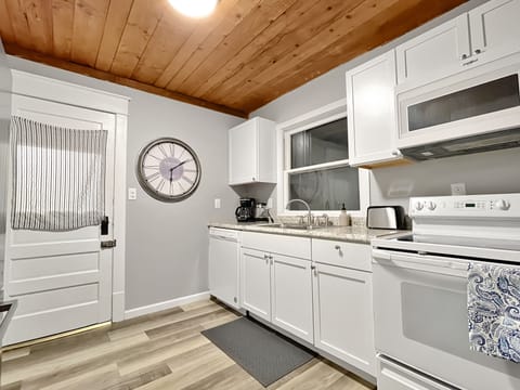 Large galley style kitchen stocked with everything you need.
