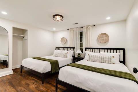 Bedroom 2 includes a queen-size bed and is thoughtfully arranged to create a cozy and restful environment.