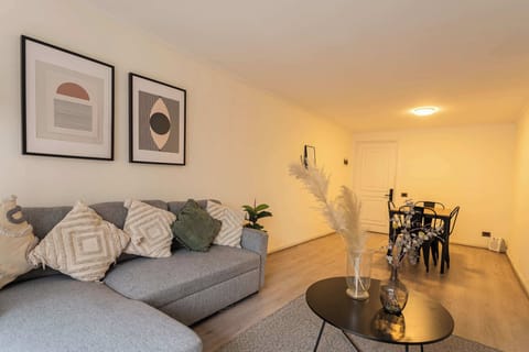 Relax in this stylish living area with modern decor and a cozy sofa, perfect for unwinding after a day of exploring.