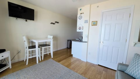 Dining area with kitchen beyond