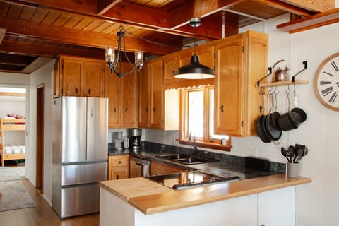 Fully stocked kitchen with glass top stove and dual oven