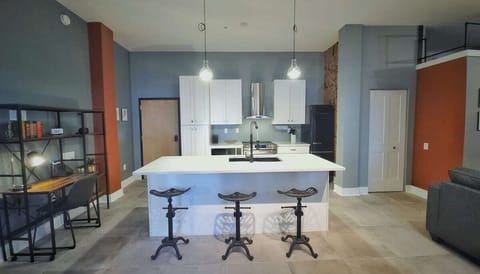 Fully stocked, well designed kitchen. Separate desk and working space that is both calming and relaxing.  Washer and dryer are located in the closet to the right