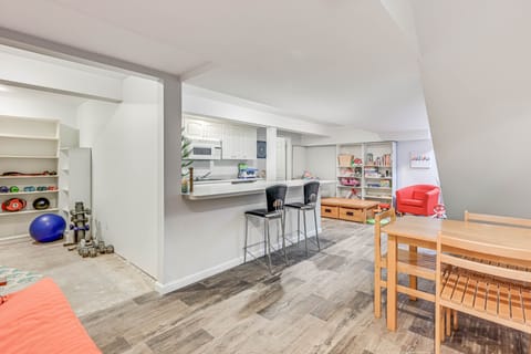 Lower level rec room. Second kitchen. Game table. Kids toys.