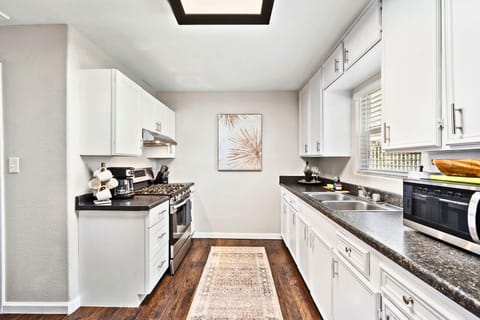 Kitchen: Whip up culinary delights in this modern space with sleek appliances and stylish decor!