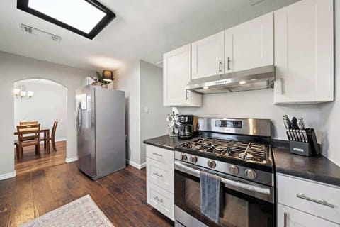 Kitchen Delight: Modern appliances and bright skylight create a chef's dream atmosphere!