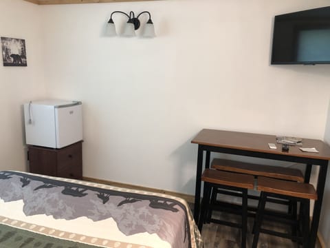 Table area and a mini refrigerator.