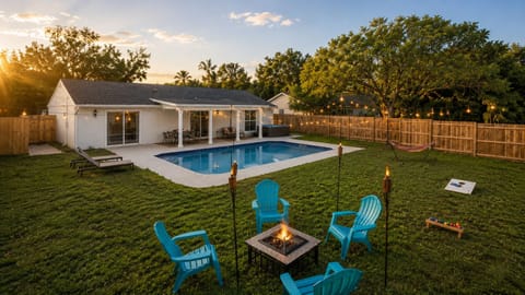 Fenced backyard with a pool, hot tub, fire pit, and room to spread out