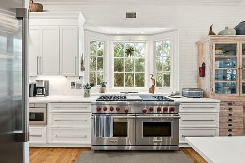 Kitchen - Wolf gas range stove with two convection ovens