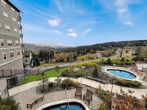 Welcome to Soaring Eagle Lodge with outdoor hot tubs, sauna, beautiful views, and the most beautiful building at Snowshoe. 