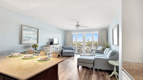 Relax in this bright living room with coastal views and comfortable seating.
