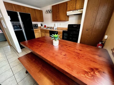 Full kitchen with range, oven, coffee maker, dishwasher, microwave and refrigerator/freezer.  Most other small appliances are present as well.