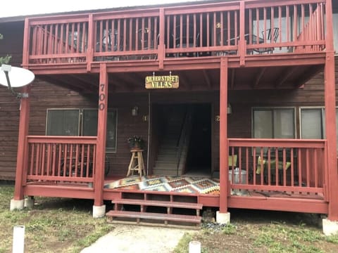 The condos feature an outside porch area for relaxing.  There is a barbeque grill available for use along side the picnic tables just off of the porch area.