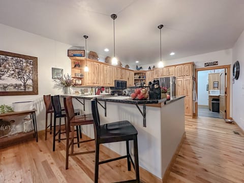Bar with for 4 chairs and dining room table for 6-8.