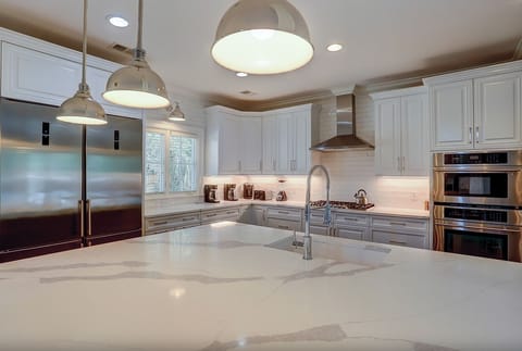 Kitchen with double refrigerator/freezers