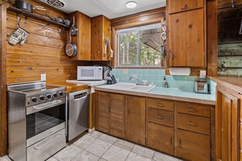 Kitchen with range, dishwasher, toaster, coffee maker, microwave, wtr kettle etc