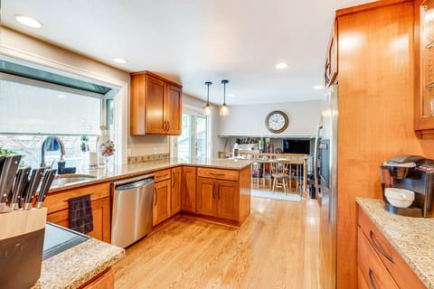 View of the kitchen looking towards the patio slider and lower family room area