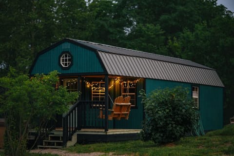 Unwind on the porch swing, soak in the glow, and let the stillness of Jack`s Tiny Cabin work its magic.