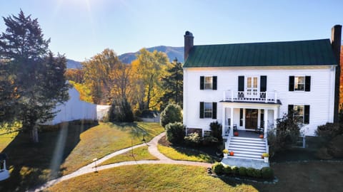 To enter the Farmhouse, walk up the brick pathway to the side door.