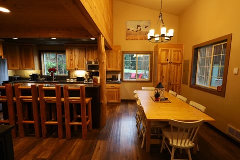 3 eating areas - bar, small table, and large table - seating for 16 total. 