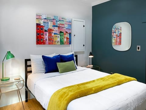 Relax and unwind in this quaint bedroom after your long day of exploring Savannah!