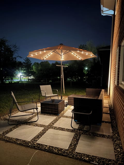Outdoor sitting. Enjoy the night’s light umbrella