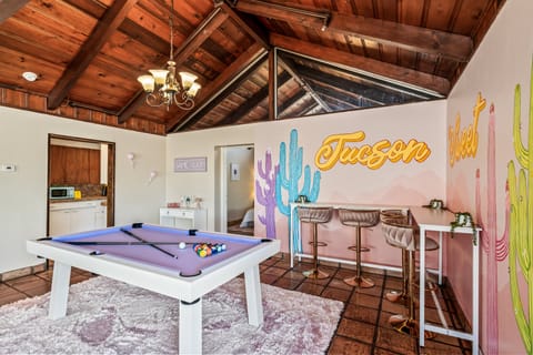 Pool table and beverage cart and bar seating for 3