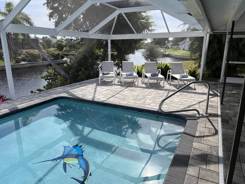 Waterfront luxury with a private HEATED pool, dock, and peaceful canal views — welcome to Villa Blue Marlin.
