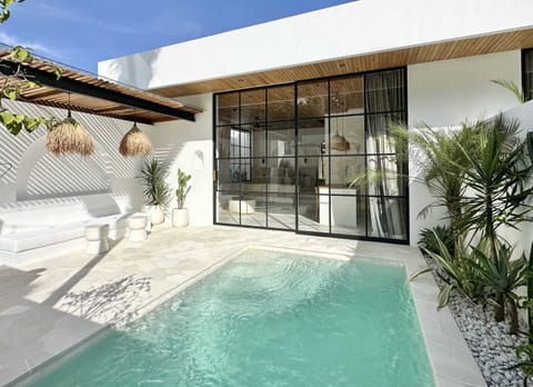 Private outdoor area with a swimming pool and lounge