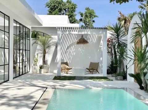 Outdoor lounge with a large swimming pool