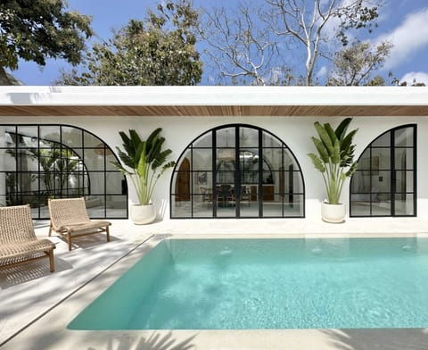 A beautiful white villa with large arched windows