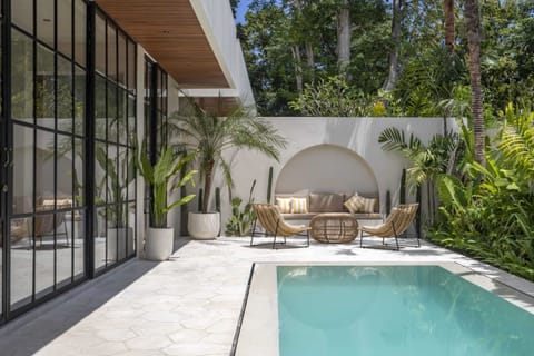 Outdoor area with a swimming pool and a lounge