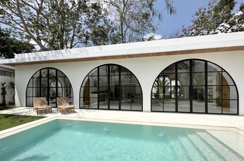 Luxurious two-bedroom villa with a large swimming pool and two daybeds