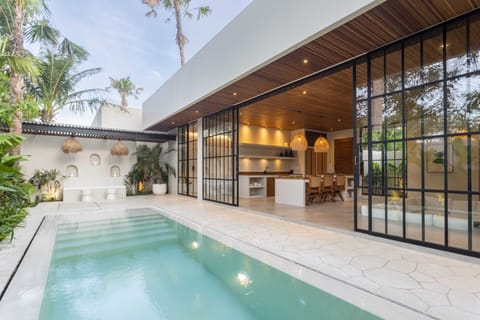 Outdoor area with a swimming pool and a lounge