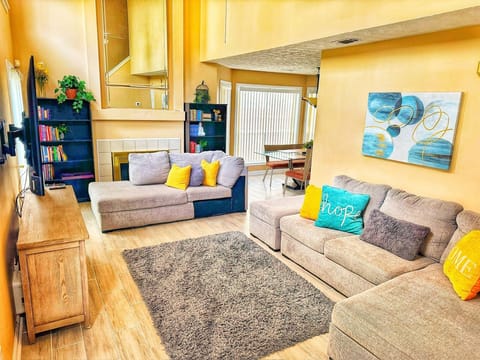Family Room with Smart TV, Books, Toys, and High Chair tucked away.