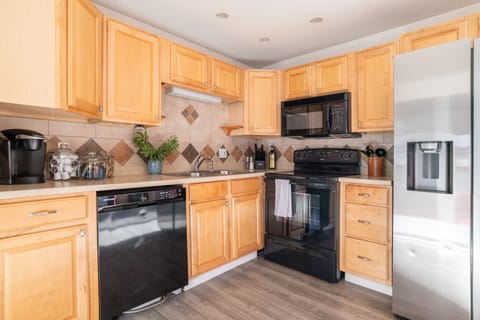 The kitchen is fully equipped with modern appliances
