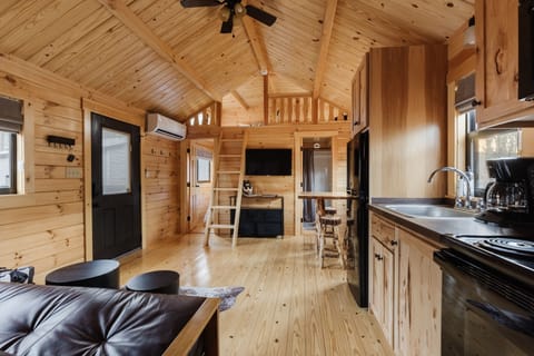 View of the doorway to Bedroom 2, ladder leading to the loft space, and full bath.