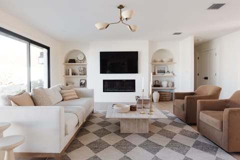 Gather around the fireplace with family and friends in the spacious living room.